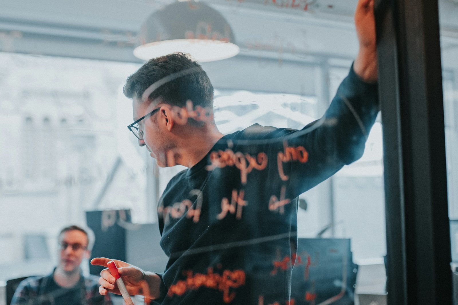 A heated discussion in front of a glass board